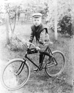 H.R. Gibbons on bike, c. 1905.