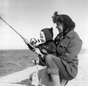 Joan and Jim fishing, c. 1962.