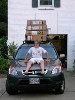 All loaded -- our CRV with 4 bikes in boxes; Avery in command.