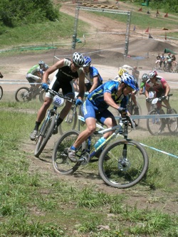 Racers charge around mountain bike short course at Deer Valley.