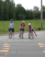 Care and the boys wait to cross, at the bottom of the Axe des Sommets.